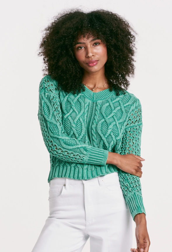 Wrap yourself in timeless comfort with our Cable Knit Sweater. The vintage washed, V-neck design boasts a unique twist cable weave finish for a classic yet modern look. The relaxed fit and solid color yarn create a cozy feel, while the ribbed neck, cuffs, and waistbands add a touch of elegance. Each piece is expertly crafted for a "ever-unique" pattern and coloration, making it a treasured addition to any wardrobe.