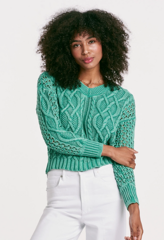 Wrap yourself in timeless comfort with our Cable Knit Sweater. The vintage washed, V-neck design boasts a unique twist cable weave finish for a classic yet modern look. The relaxed fit and solid color yarn create a cozy feel, while the ribbed neck, cuffs, and waistbands add a touch of elegance. Each piece is expertly crafted for a "ever-unique" pattern and coloration, making it a treasured addition to any wardrobe.